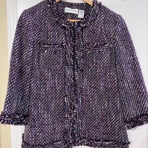 Purple, white, and blue tweed with fringed trim. 4 clasps to close, fully lined.